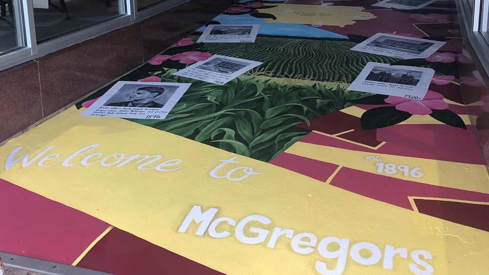 McGregors Mural on the ground in the entrance with the words "Welcome to McGregors"