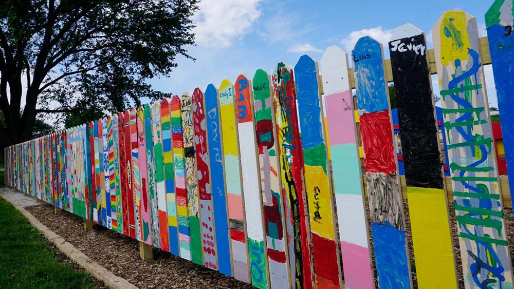 Skate Park fence with individually colorfully painted slats