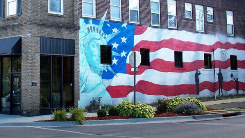 Veteran's Mural of an American flag with the Statue of Liberty in the foreground