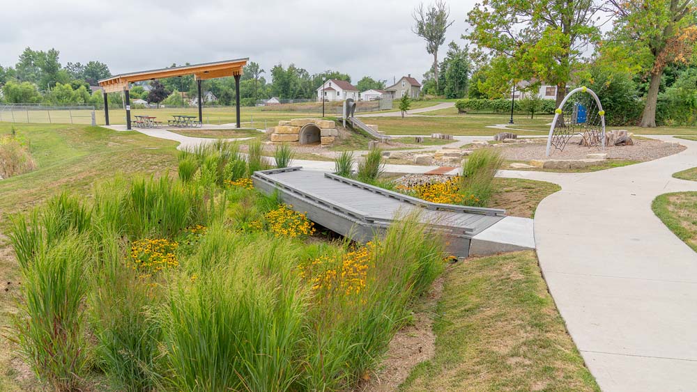 West End Park with pergola, tunnel, bridge walkways, and native flowers and grasses